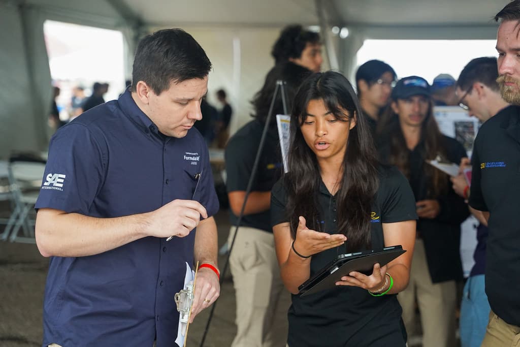 Team working on cost analysis and car assembly